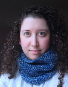 Sarah Curzi profile photo - woman with a blue scarf